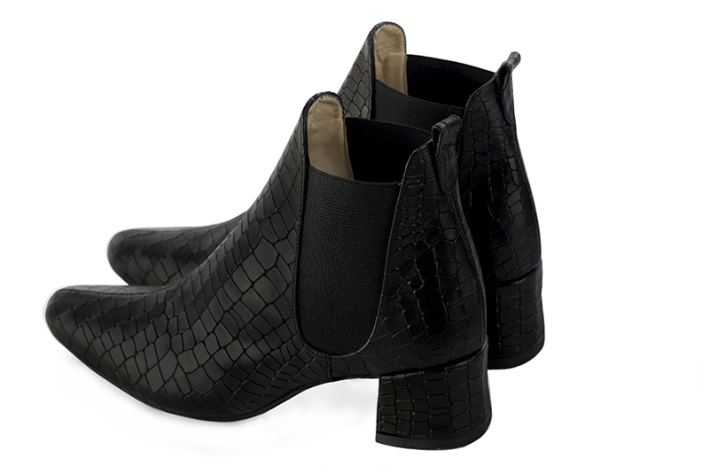 Satin black women's ankle boots, with elastics. Round toe. Low flare heels. Rear view - Florence KOOIJMAN